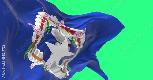 Close-up of Northern Mariana Islands flag waving isolated on green background