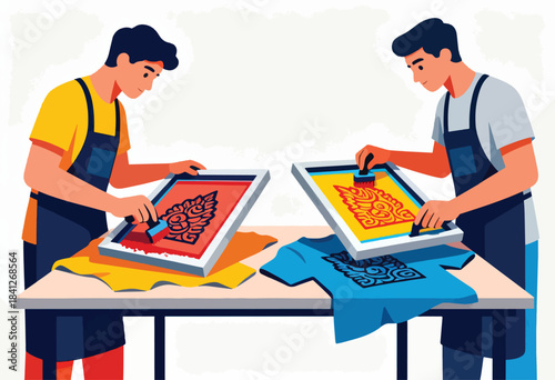 Two men screen printing shirts with intricate patterns