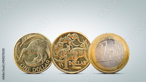 New Zealand and Australian Dollar Coins Next to Euro Coin