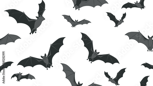 A flock of black bats flying in various directions isolated on white background for halloween or spooky themed designs and decorations