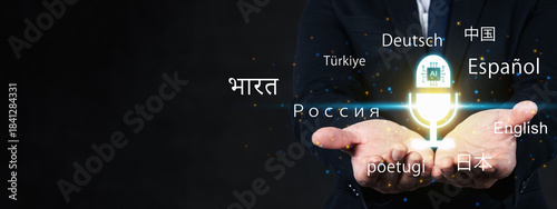 Businessman presenting artificial intelligence language translation above his open hand. Glowing AI logo inside a virtual microphone surrounded by several languages