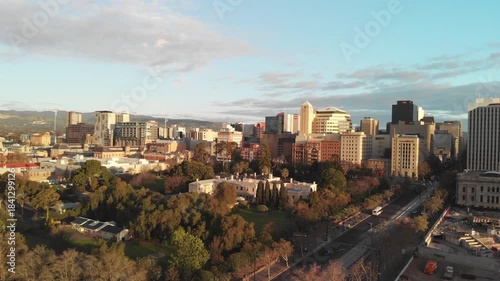 Aerial view of Adelaide skyline in spring, drone going up