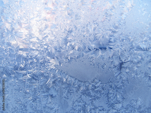 Beautiful ice pattern on window glass, natural winter background