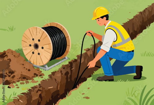 A worker in a hard hat and safety vest installs cable from a large spool in a trench