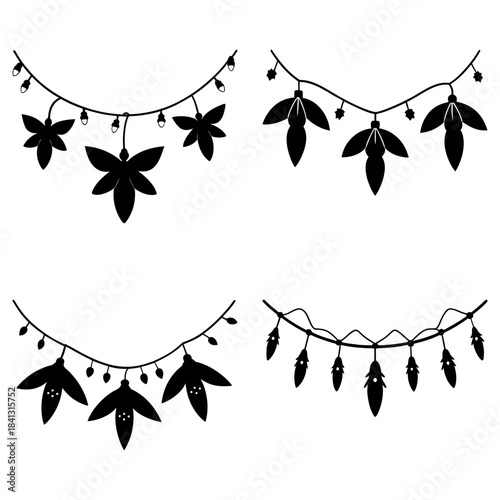 Black and white floral and leaf garland decorations with hanging lights leaves