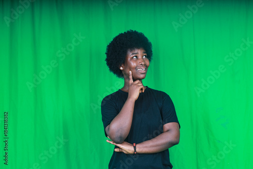 Young woman thinking with a thoughtful smile
