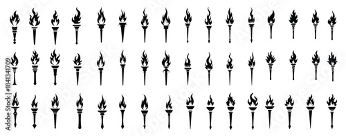 Collection of black torch icons with flames fire symbol