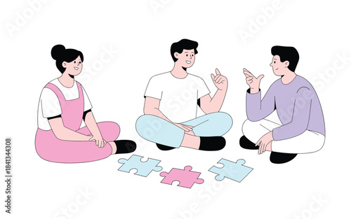 Three people sitting on floor discussing puzzle pieces
