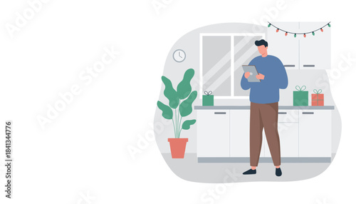 A man uses a tablet in a festive modern kitchen decorated with holiday lights and gifts Digital shopping concept