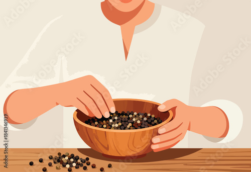 Hand selecting peppercorns from wooden bowl