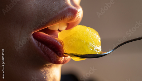 Wallpaper Mural Lips tasting a micro spoonful of lemon sorbet with soft cinematic blur Torontodigital.ca