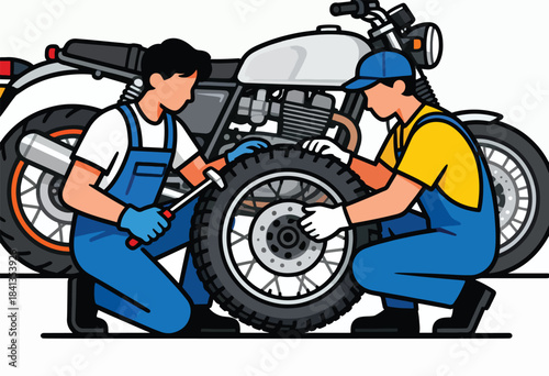 Mechanics working on a motorcycle tire