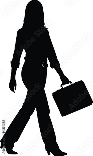 Silhouette of a determined businesswoman walking with a briefcase