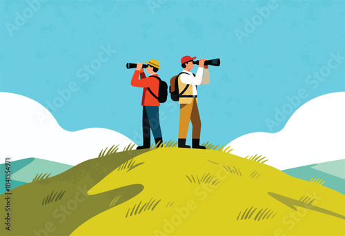 Two hikers on a grassy hilltop peer through binoculars at a distant landscape
