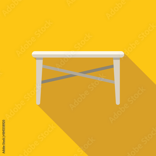 Folding table with cross legs on yellow background representing furniture, portability, and minimalist design