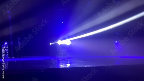 Illuminated stage spectacle showcasing vibrant blue lights and dynamic patterns