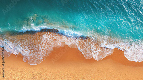 Fototapeta Naklejka Na Ścianę i Meble -  Sea background top view. Waves. Golden sandy shore. Ocean coastline. Blue lagoon. Deserted beach. Clear water surface.