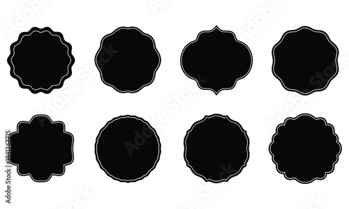 Collection of eight black abstract frames and borders with rough edges on a white background