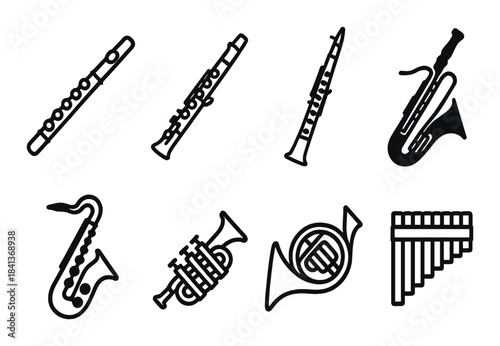 Set of musical wind instruments silhouettes including flute, clarinet, saxophone, trumpet, french horn, pan flute