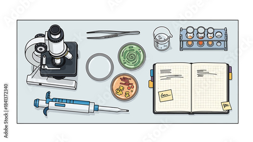 Microscope, pipette, petri dishes, and notebook depicting scientific research and laboratory experiments