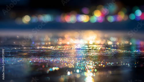 Abstract gradient holiday lights reflecting on smooth ice