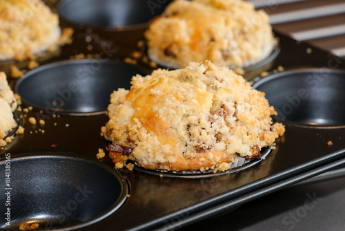 Принти на полотні Golden brown muffins with a crumbly topping, just out of the oven