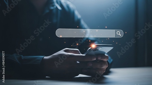 Man working with laptop and smartphone searching for information online