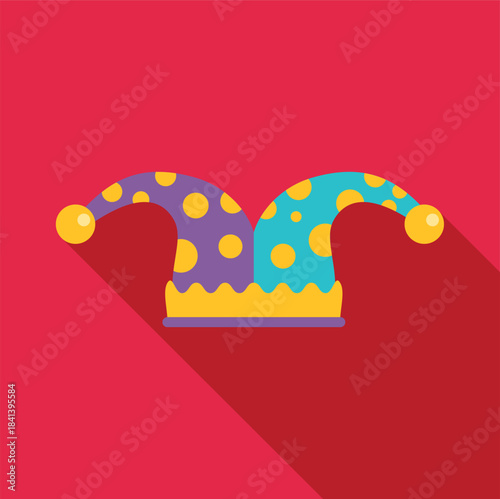 Jester hat with polka dots on a red background symbolizing comedy and celebration