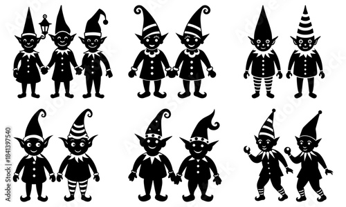 Group of smiling elves with pointed hats and festive clothing on white background holiday
