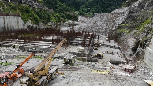 Construction Progress of Arun III Hydro Project Nepal: Aerial Shot of Dam Foundation and Spillway Works amidst Rugged Himalayan Terrain for Power Generation