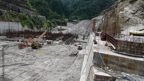Industrial Landscape of Nepal: 4K Aerial Footage of Arun III Hydroelectric Dam Building Process featuring Reinforced Concrete and River Diversion Structures