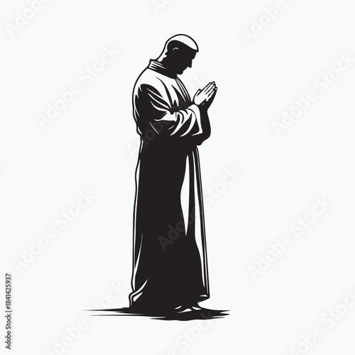 silhouette of a priest praying