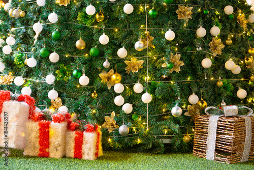 present boxes and Christmas tree at night at horizontal composition