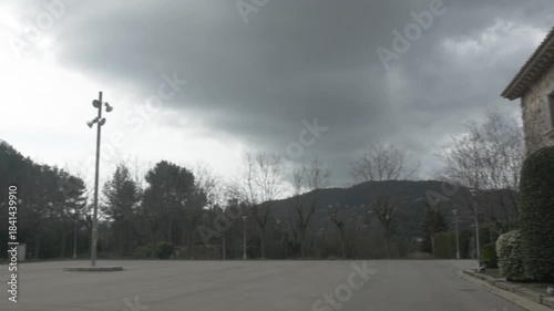 Stone house Polecam jib street lamp bushes plants windows pan left