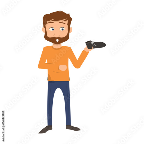 Man holding and looking closely at a black shoe, checking the quality