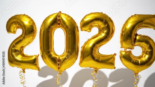 Golden balloon numbers 2025 against white background celebration concept