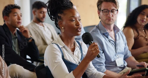 Business, microphone and question with woman in audience at development seminar for feedback or solution. Asking, conference and speaking with employee in crowd of workshop for discussion or query