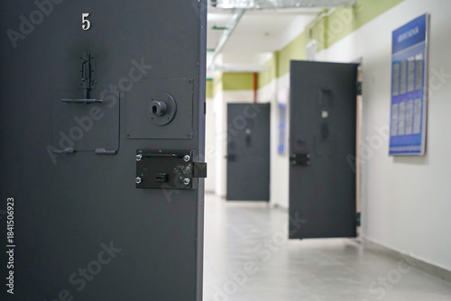 A metal door with a window in a juvenile colony.