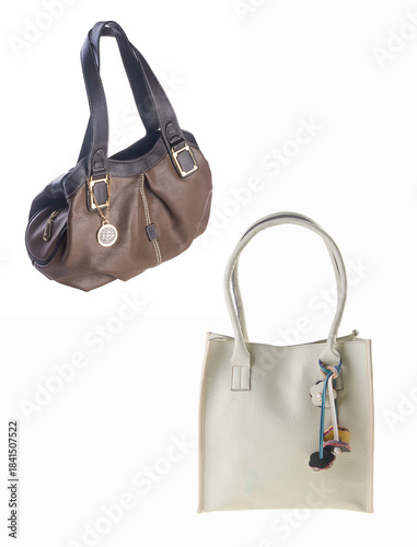A small handbag with a textured front flap, a short shoulder strap, and a butterfly-shaped metal detail on the front.