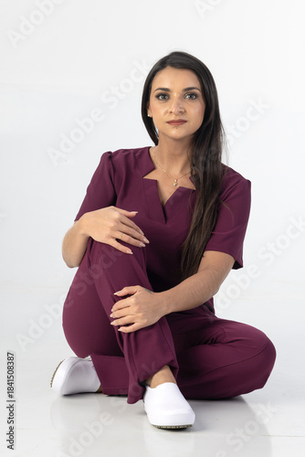 Beautiful woman wearing professional medical healthcare lab coat in studio photography