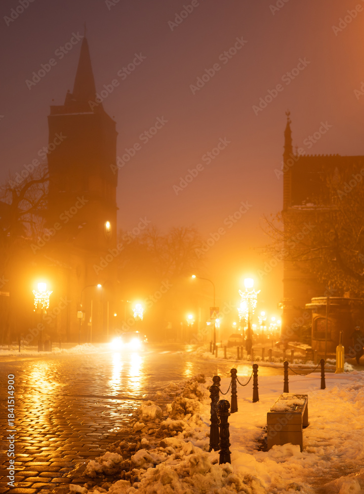 Fototapeta premium Blurry Evening Photo Of A Winter Street In Fog