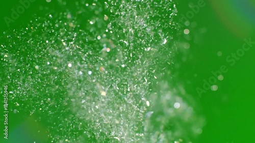 Sparkling particles suspended in air with controlled particle sparkle accent above effect ad_ready green screen product pedestal