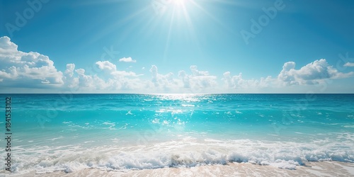 Fototapeta Naklejka Na Ścianę i Meble -  Sea waves rolling under a bright sky, highlighting coastal landscape preservation