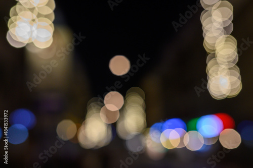Blurry defocused lights in night time. Blurred background with copy space.