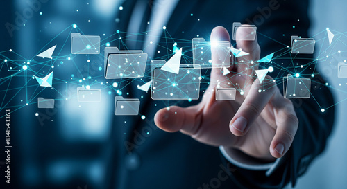 Digital interface and data interaction visualized by a hand touching floating icons