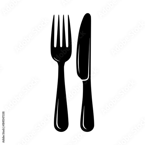 Dinnerware Delight: A simple yet elegant presentation of a fork and knife, essential dining utensils symbolizing the joy of sharing meals.