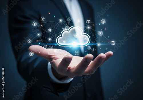 A businessman presenting a glowing cloud network of connected data points in his hand