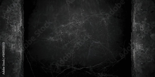 Old wall with black background featuring abstract concrete scratches used as a textured backdrop for graphic design, background for text and layout