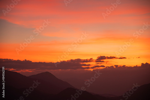 Wallpaper Mural Bright sunset over the silhouette mountains at evening time. Torontodigital.ca