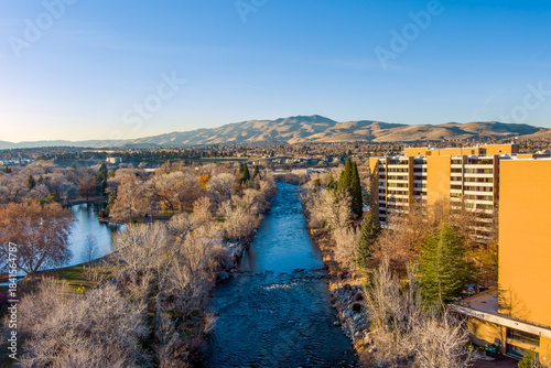 Aerial view of Reno Nevada looking Northwest from downtown with the Truckee River a residential area and Peavine mountain in the distance during late autumn